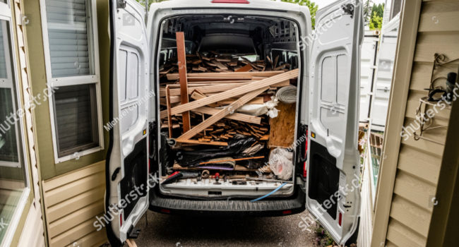 stock-photo-work-van-full-of-hardwood-removed-from-house-1098632843